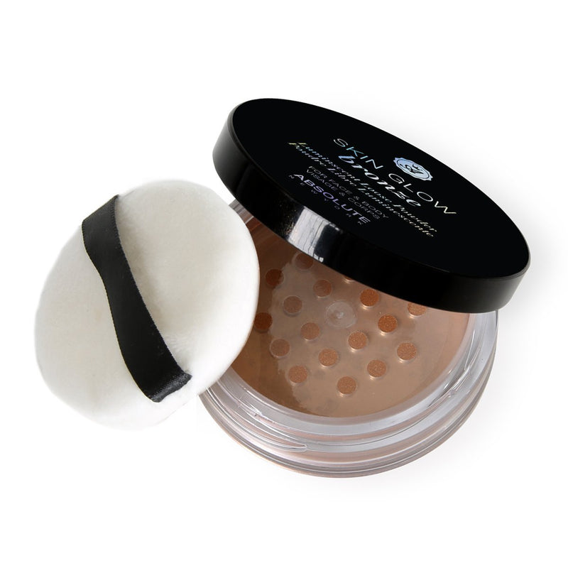 Absolute New York Skin Glow (Bronze) - pearlescent, bronze loose powder with golden micro-pearls for an illuminating glow. Packaged in a sifter jar with an included powder puff. Best suited for medium to dark skin tones.